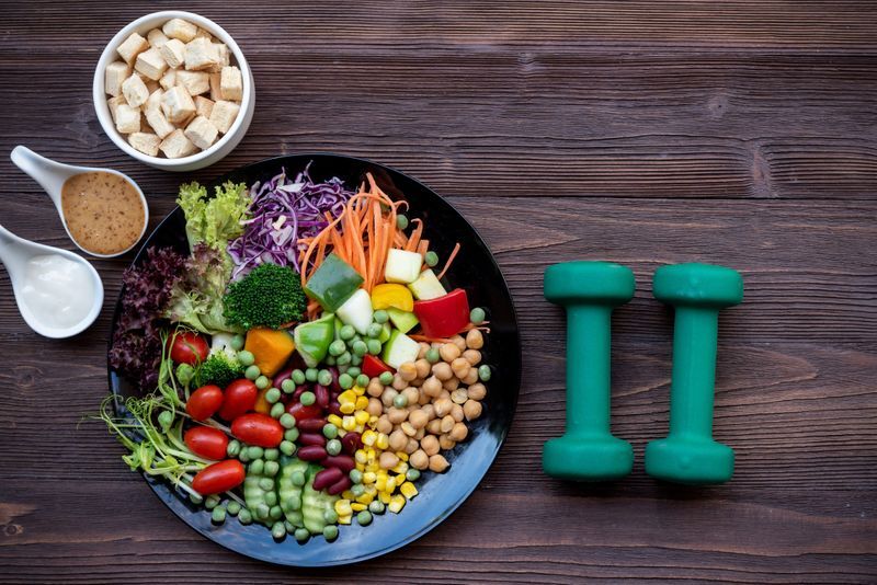 Balanced meal and hand weights representing everyday wellness